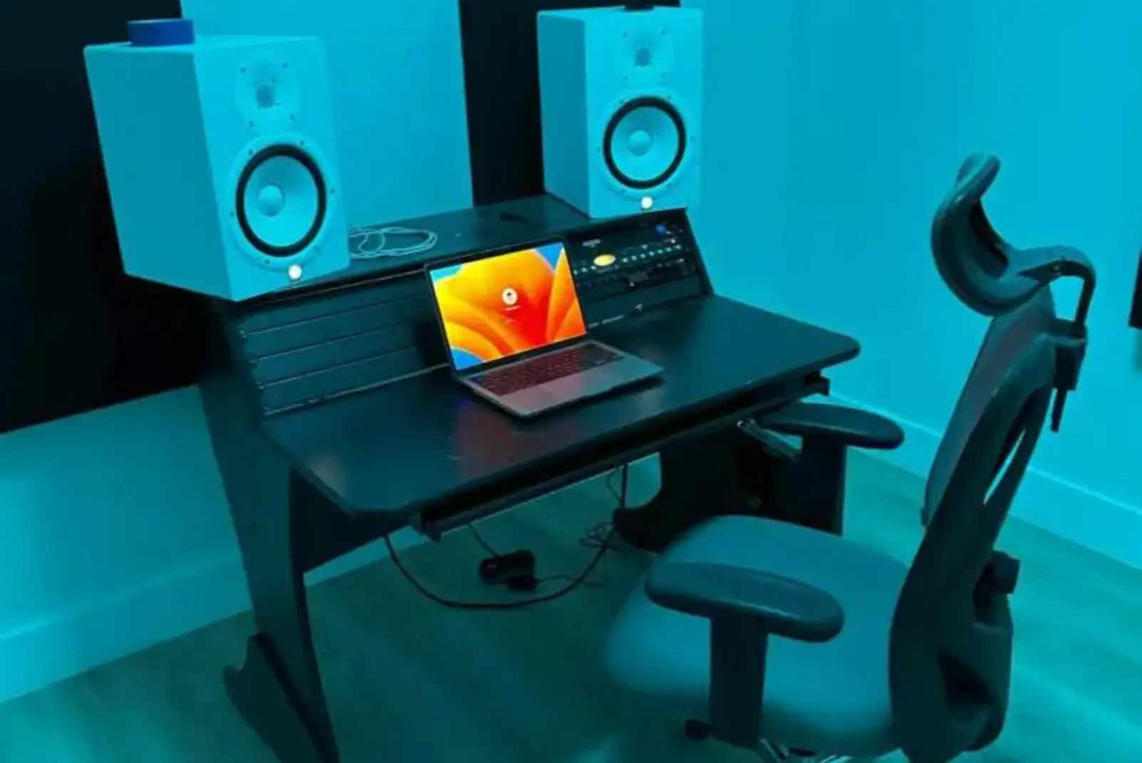 Home music studio setup with laptop.