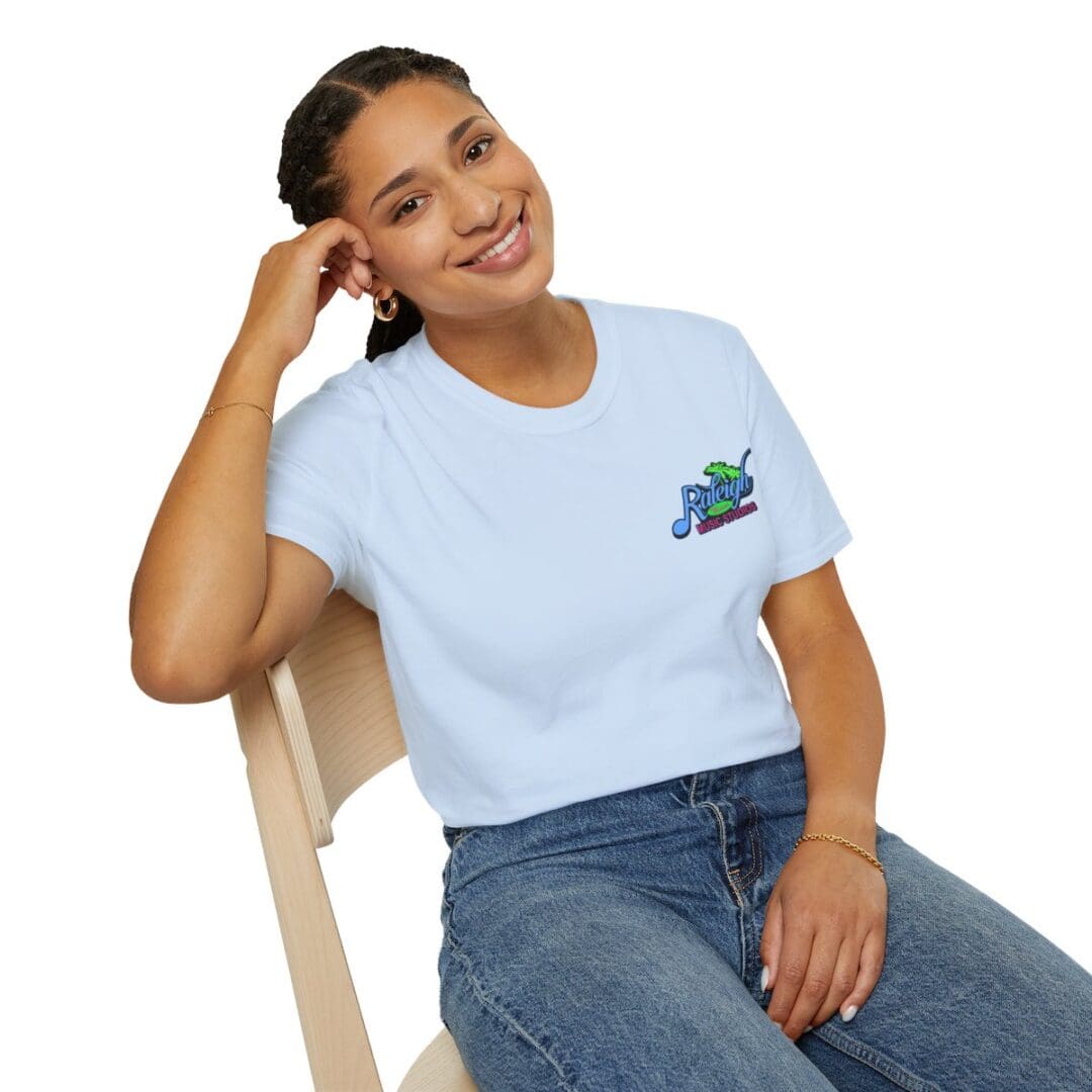 Woman in light blue Raleigh t-shirt.