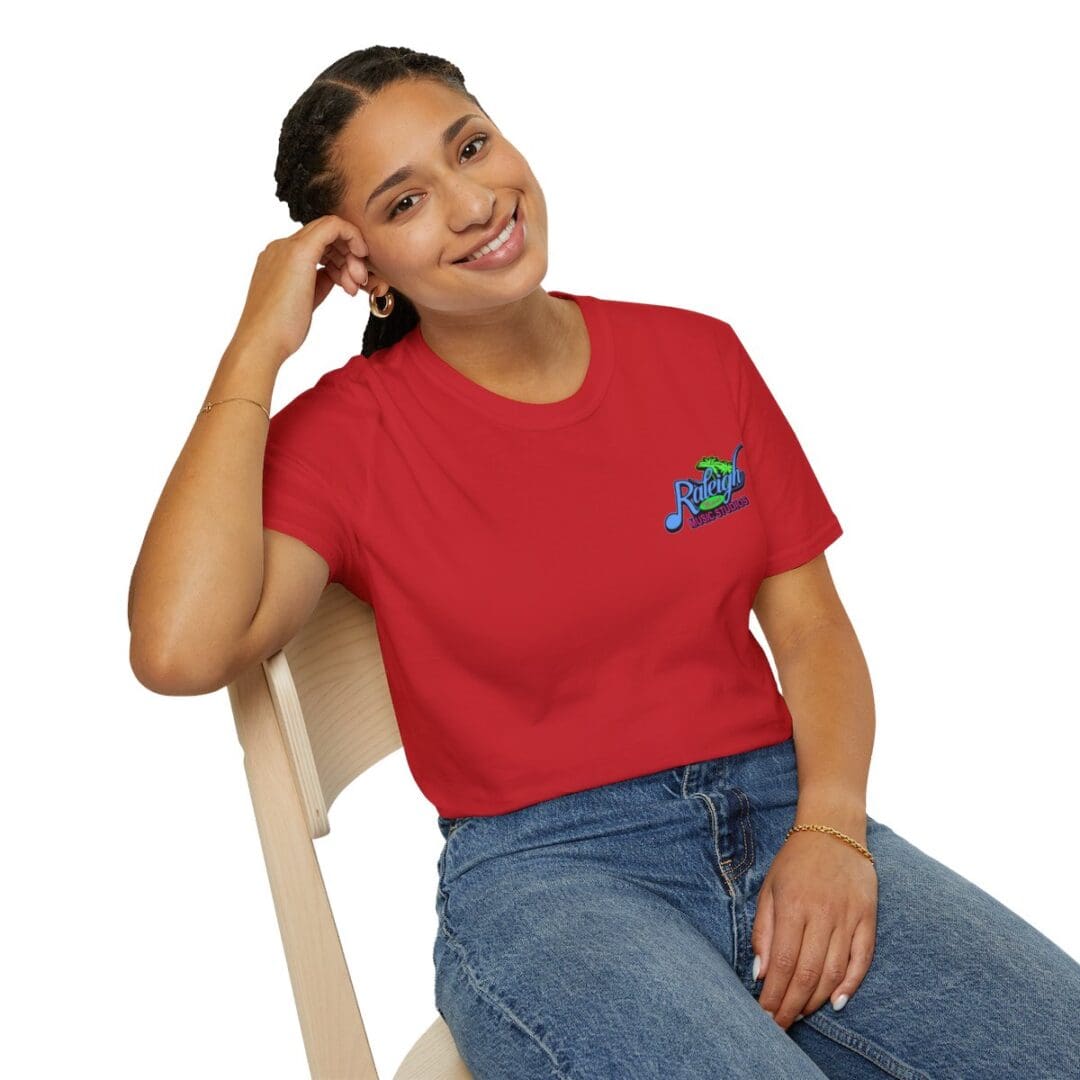 Woman in red Raleigh Music tee shirt.