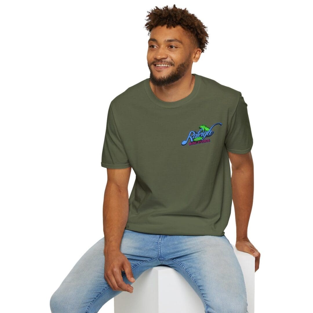 Man in olive Raleigh Music Studios tee.