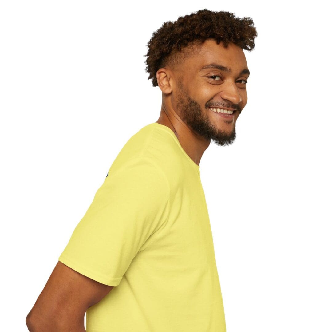 Smiling man in yellow t-shirt.