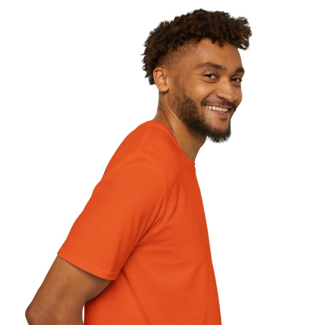 Smiling man in orange t-shirt.