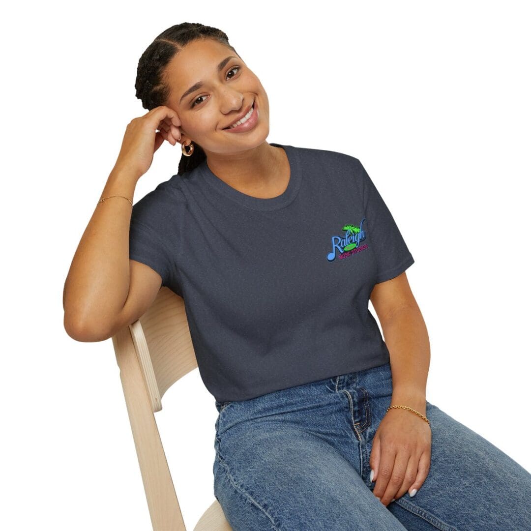 Woman in dark gray Raleigh Music t-shirt.
