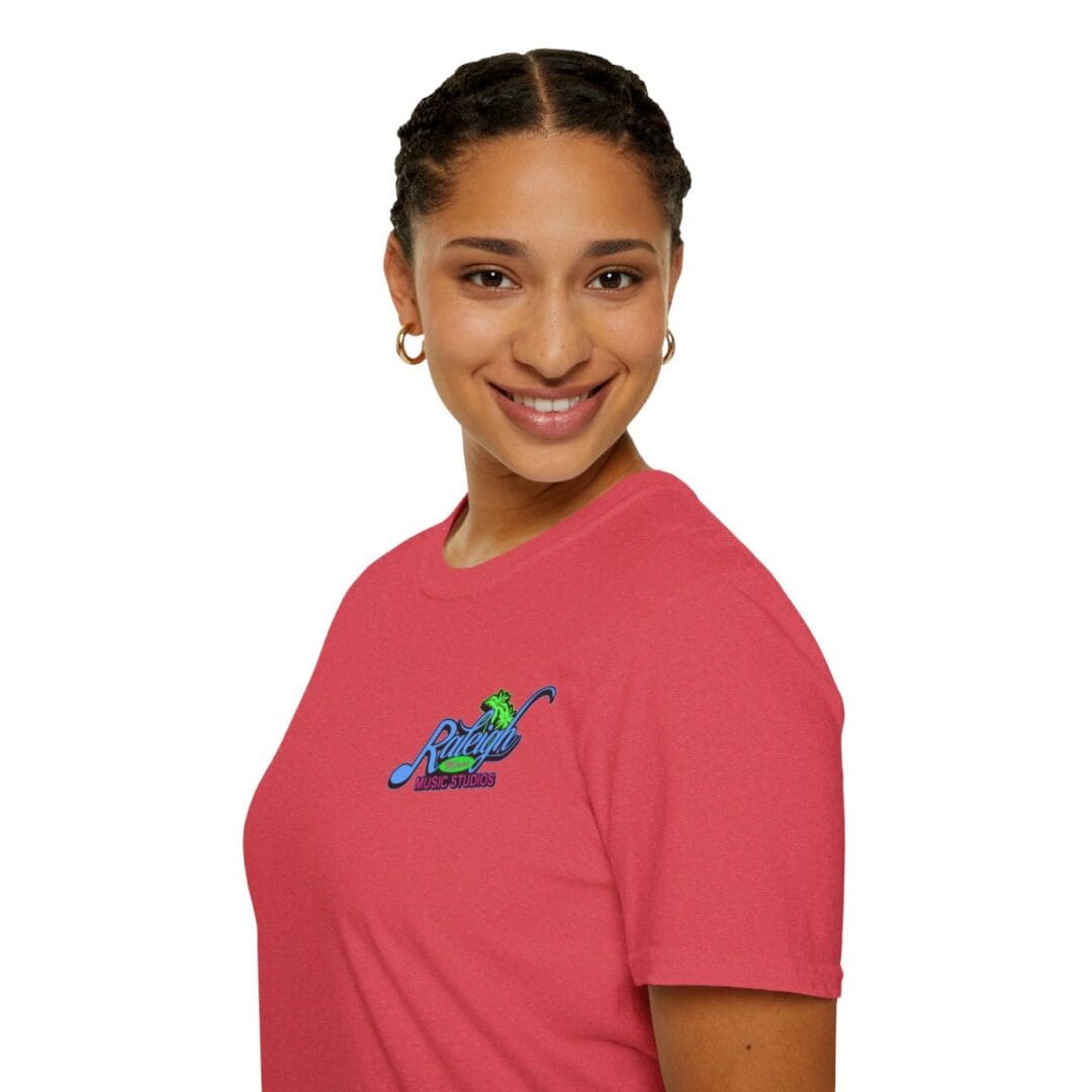 Woman in coral Raleigh Music Studios tee.