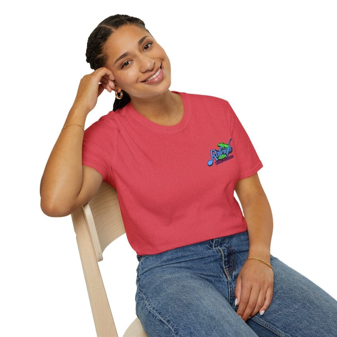 Woman in red Raleigh Music tee shirt.