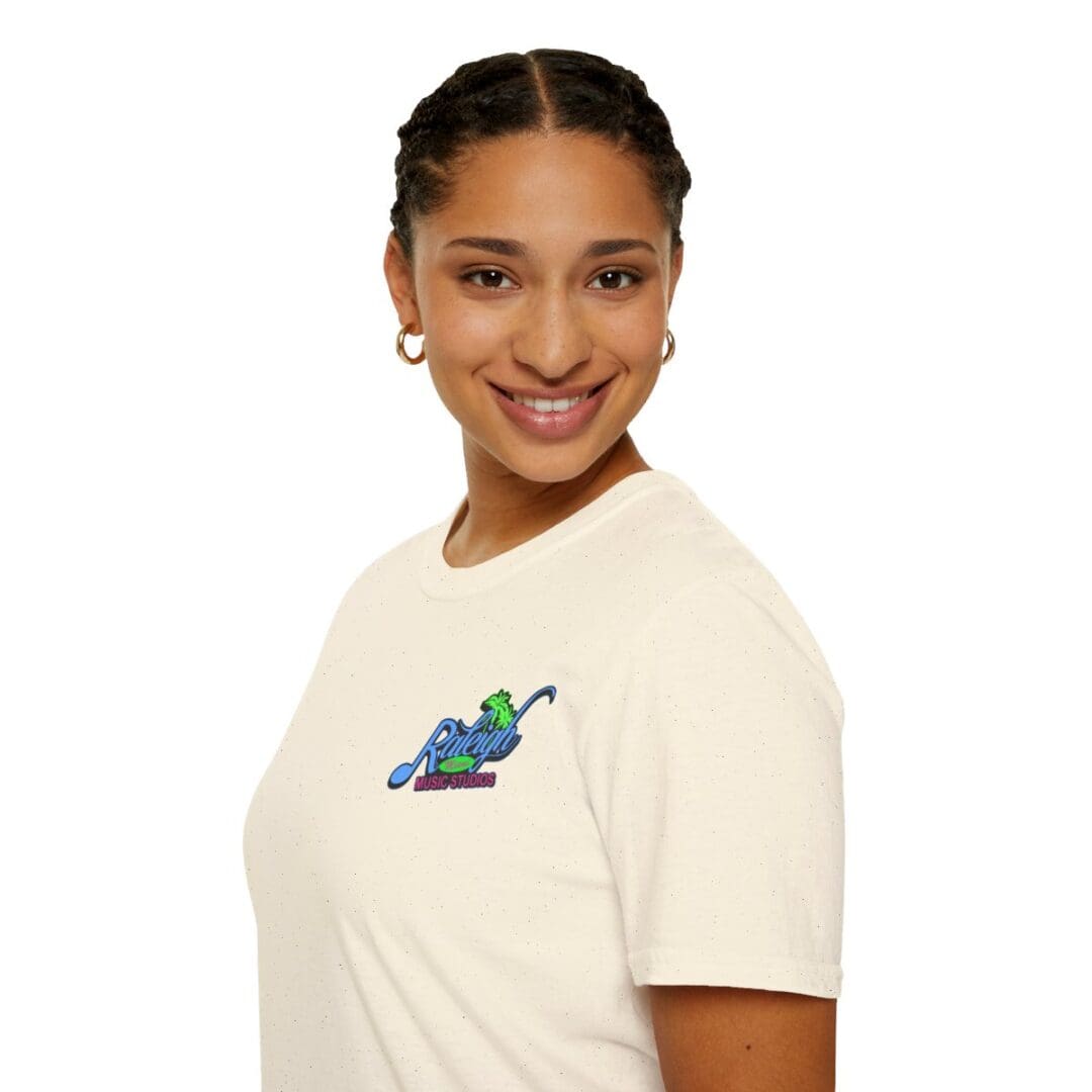Woman smiling in cream t-shirt with logo.