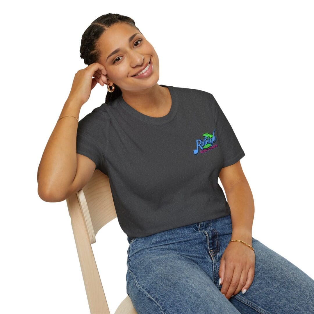 Woman smiling, wearing Raleigh Music Studio tee.