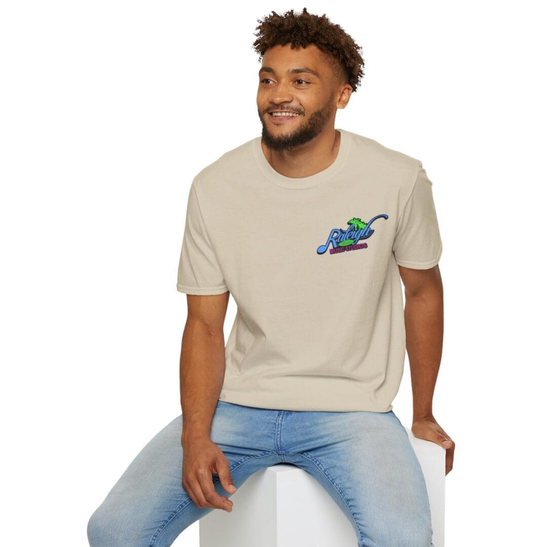 Man in beige t-shirt with Raleigh logo.