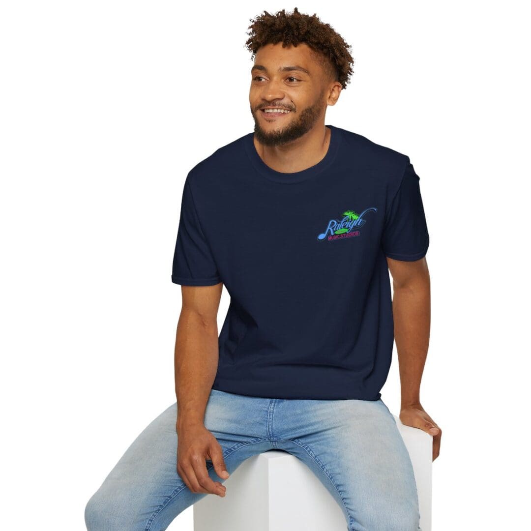 Man in navy Raleigh Music Studios t-shirt.