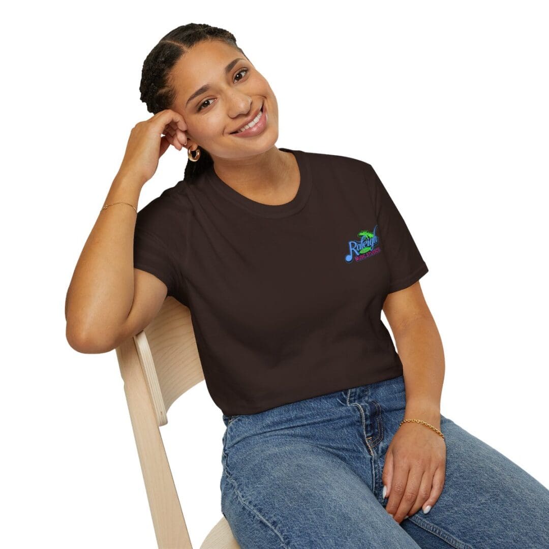 Woman in brown Rhythm Room tee shirt.