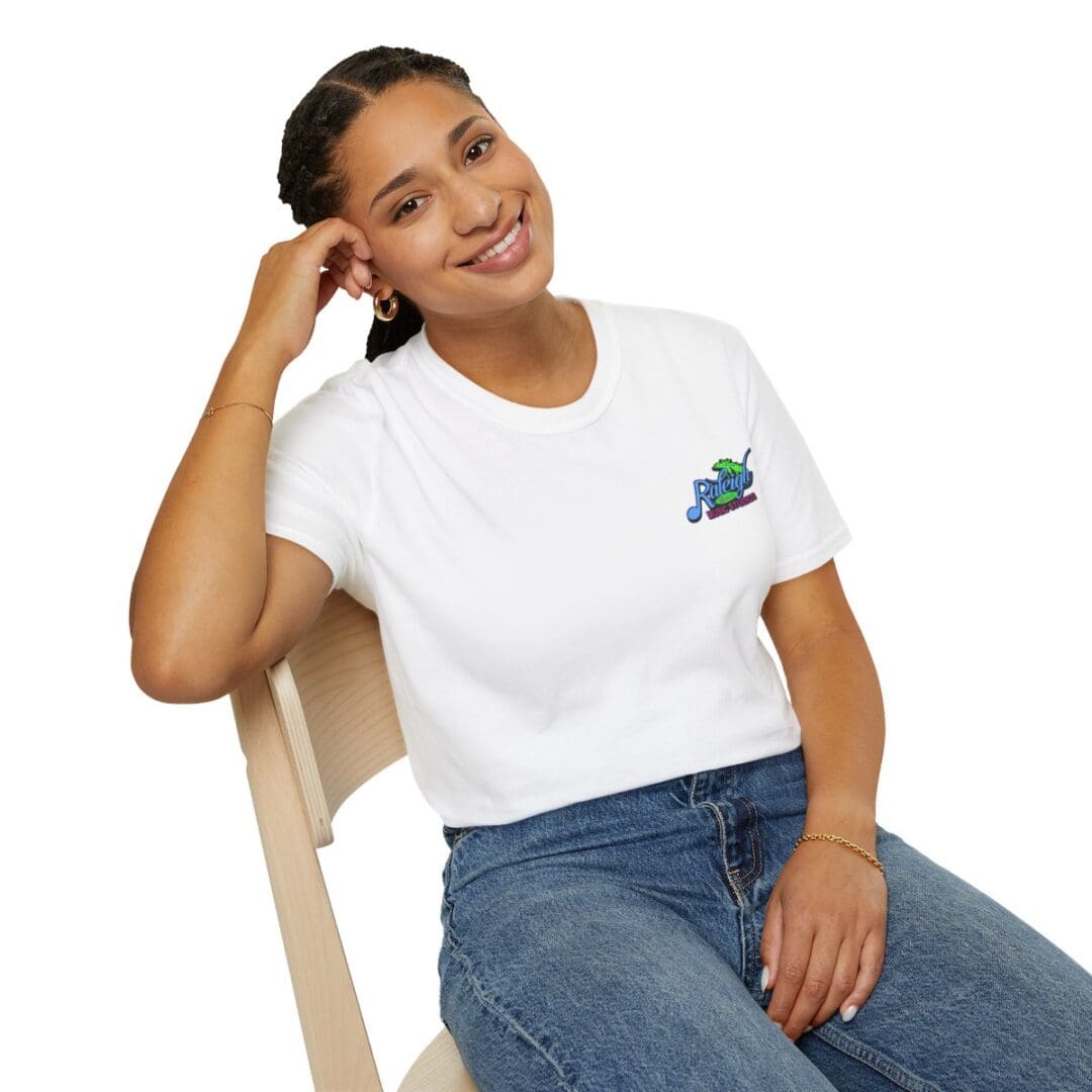 Smiling woman in white Rhythm Nation tee.