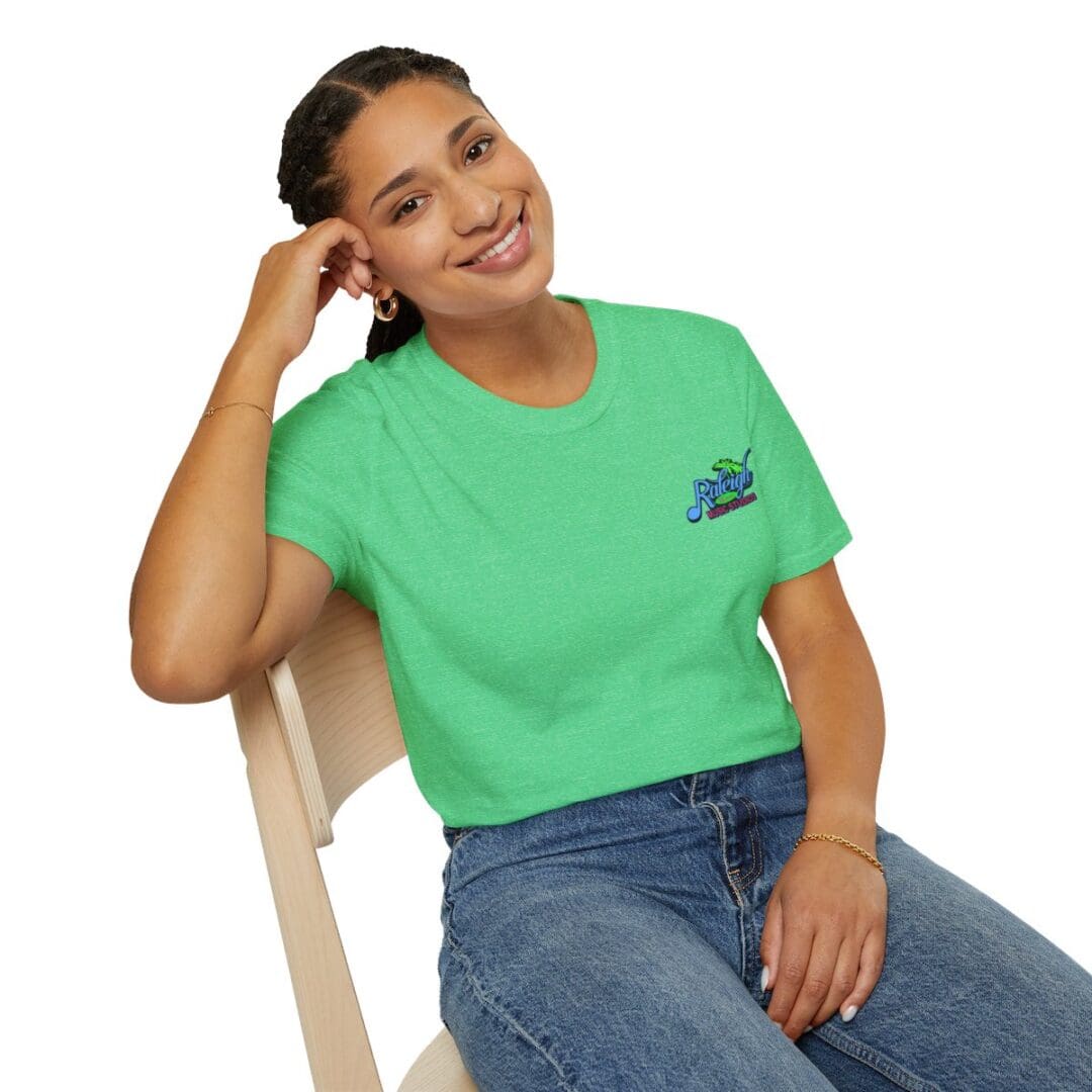 Woman in green shirt with logo.