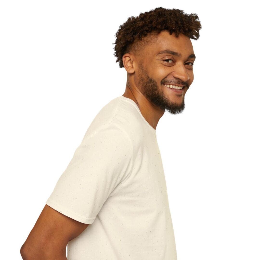 Smiling man in a white t-shirt.