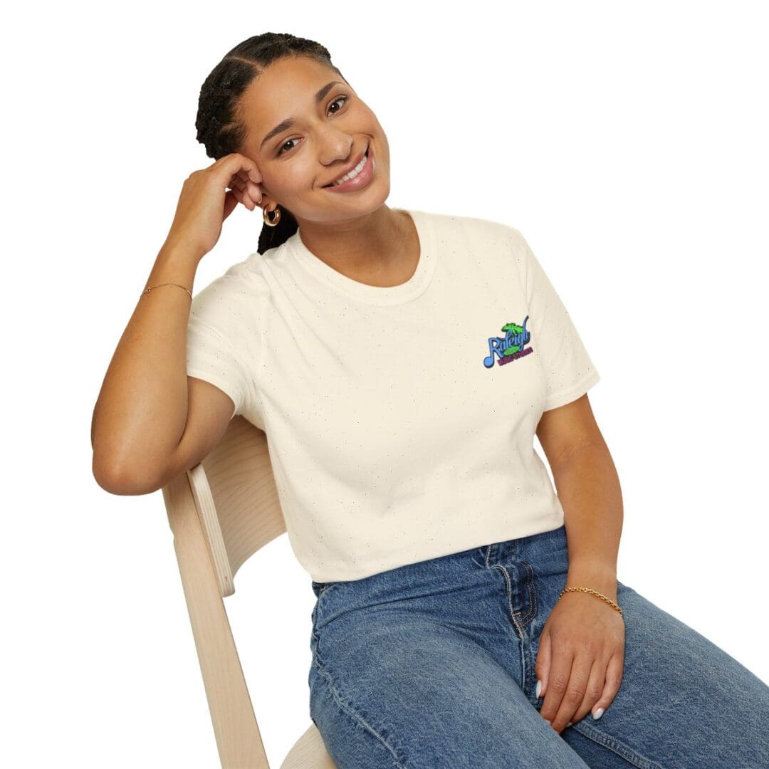 Woman smiling, wearing a Rally t-shirt.