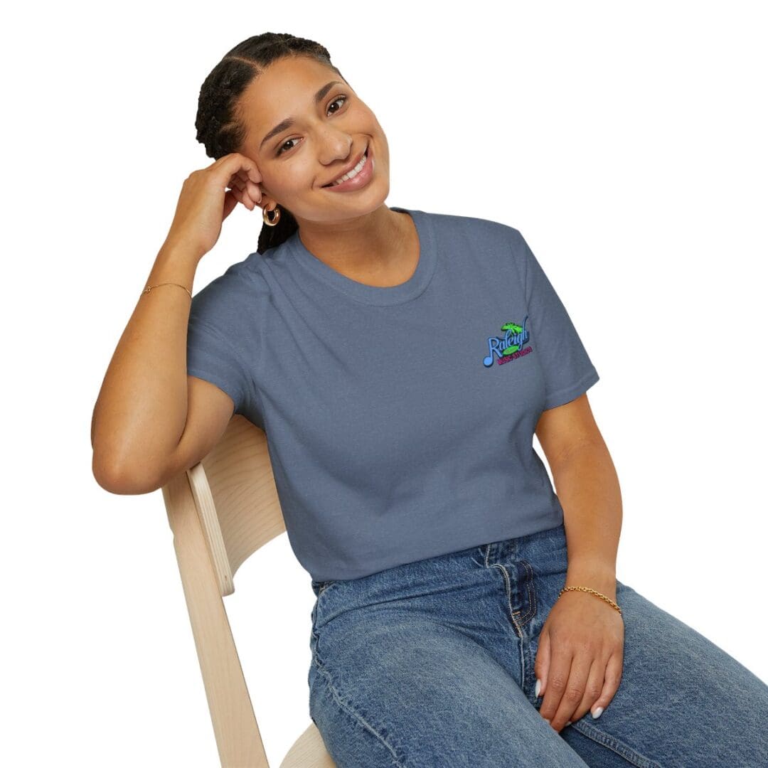 Woman smiling, wearing blue Raleigh t-shirt.