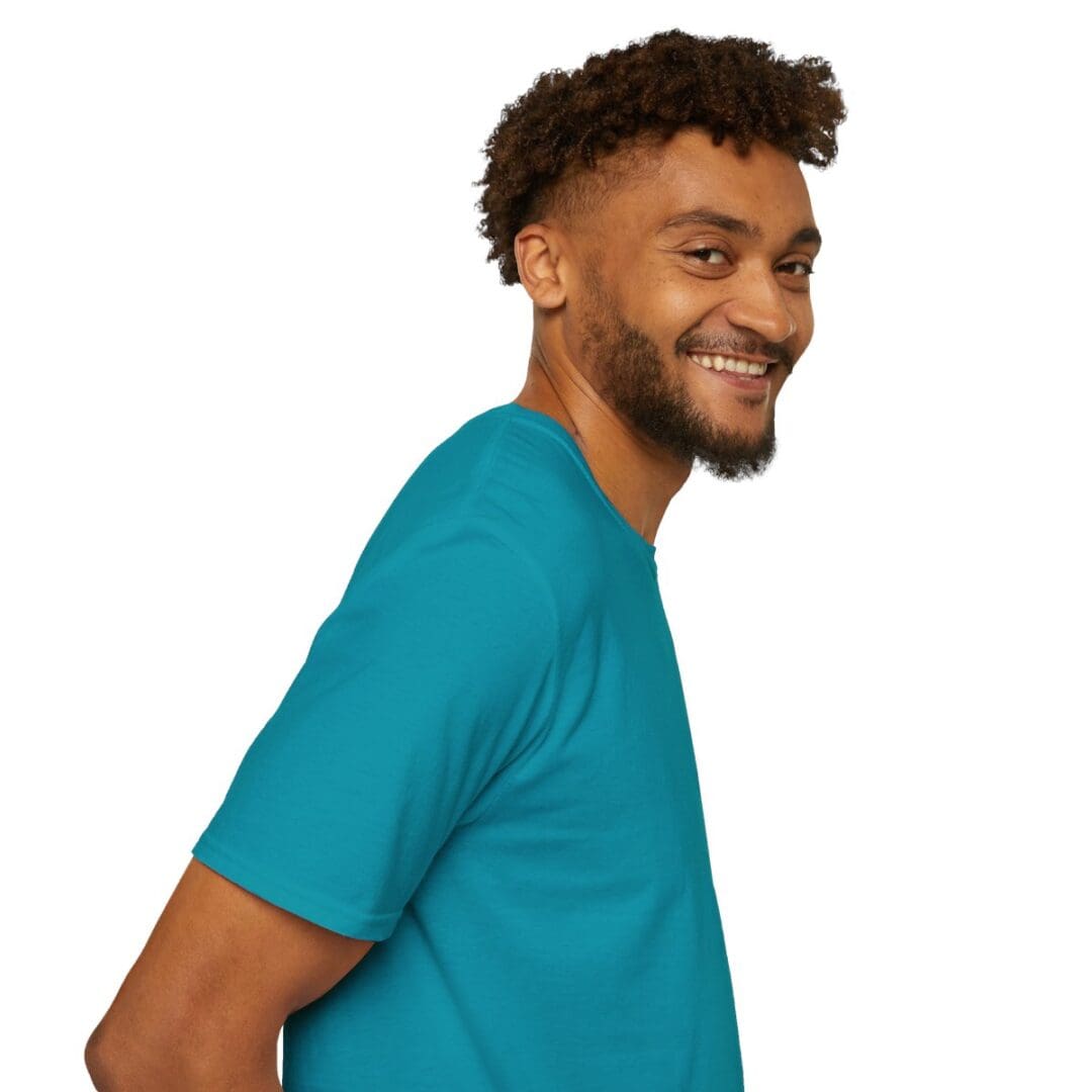 Smiling man in teal t-shirt.
