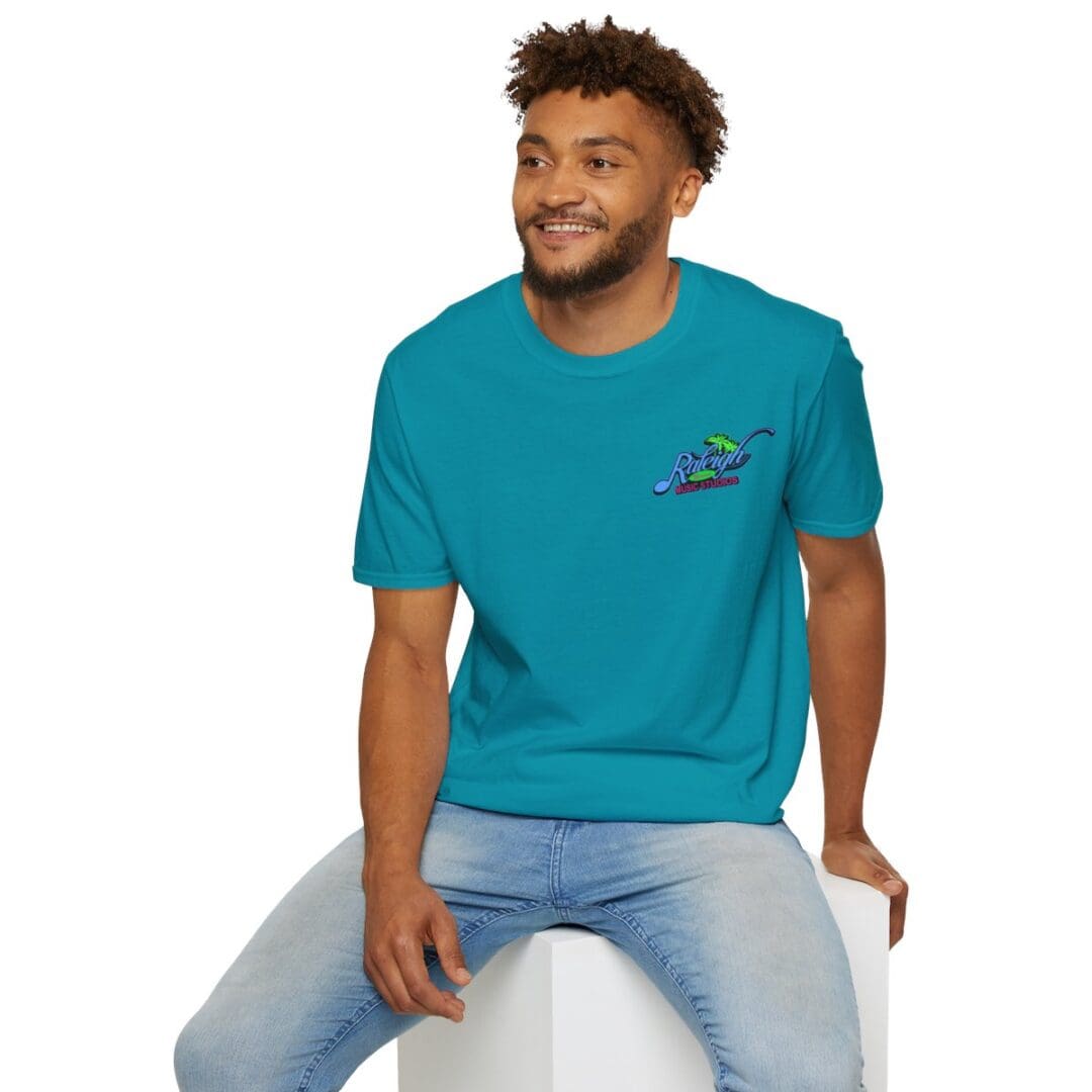 Man in teal t-shirt with logo.