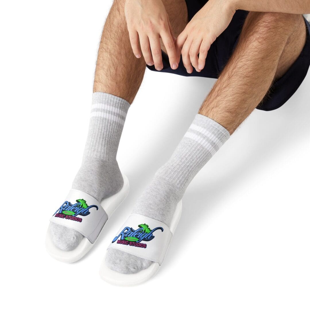 Person wearing Raleigh Music Studios slides.